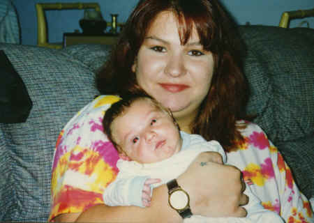 cameron - 3 weeks - crystal holding him.jpg (330125 bytes)