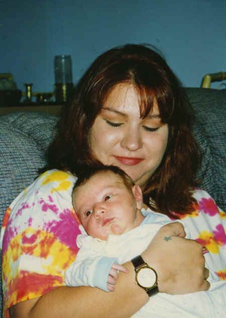 cameron - 3 weeks - crystal holding him #2.jpg (283033 bytes)